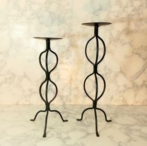 A Pair of Two Circular Tier Black Wrought Iron Candle Holders